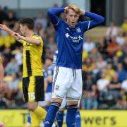 Joe Piggott is just off target with a header at Burton Albion.