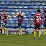 Gwion Edwards covers his face in disbelief at the officials decision leading to the Portsmouth winner