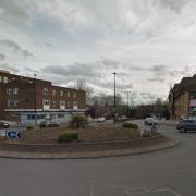 A car has crashed onto the roundabout at Norwich Road.