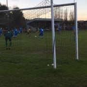 Reggie Lambe prepares to curl home a delightful opening goal for Stowmarket Town, against Norwich CBS