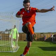 Cemal Ramadan celebrates after scoring what proved to be the winning goal for Bury Town at Cogenhoe United at the start of this season. But when will the Isthmian League start up again? Picture: NEIL DADY