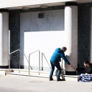 A passer by shares his food with a homeless man    Picture:SARAH LUCY BROWN