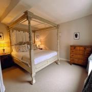 The four poster room at The Bull Inn