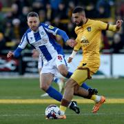 Cole Skuse (left) has been released by Colchester United and is set to be named the new manager of Bury Town.