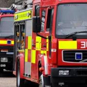 A man has been taken to hospital following a fire in Sutton Heath