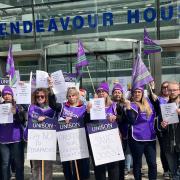 Parents and staff from a Sudbury primary school gathered outside the Suffolk County Council HQ today to protest job cuts.