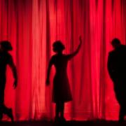 People on stage in a theatre.