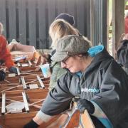 The rowing group working on the boats