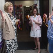 L-r: Sue Buckley, Bethan Reid and Debbie Coggins cut the ribbon to launch the new EACH shop in Felixstowe