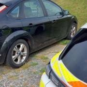 A vehicle was seized in a Suffolk town after a driver was caught displaying antisocial driving