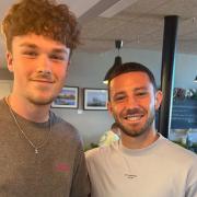 Ipswich Town star Conor Chaplin with café waiter Harvey Ling