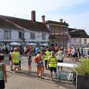 Runners gather outside the Crown hotel in Framlingham before the start of Sunday's 10k race