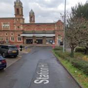 One of the cars was parked in a road next to the station