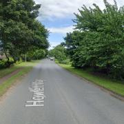 Howlett Way is closed after a car crashed into a bollard and streetlight