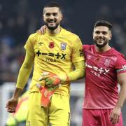 Aro Muric, left, and Sam Morsy celebrate Ipswich Town's historic win at Spurs