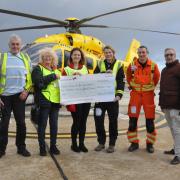 The Rotary club hands the funds over to the air ambulance