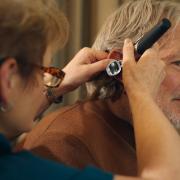 Former Ipswich Town legend Russell Osman has his ears checked by All About Hearing audiologist Karen Finch. He is challenging the stigma around wearing hearing aids