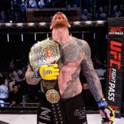 Colchester's James Webb celebrates winning the light heavyweight title at Cage Warriors 180