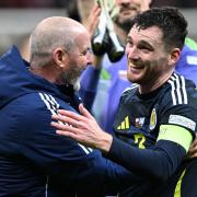 Andy Robertson (right) celebrated his late winner with Steve Clarke (Rafal Oleksiewicz/PA)