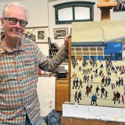 Simon Farr with his recreated Lowry painting.