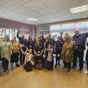 Members of East Suffolk Council, Lowestoft Town Council and the Kirkley People’s Forum celebrating the announcement at a bake sale to mark Britten’s birthday. Picture: Zeb Soanes