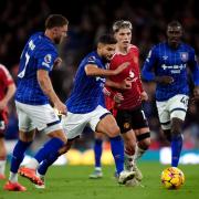 Ipswich Town skipper Sam Morsy drives through the Manchester United midfield.