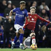 Ipswich Town's Omari Hutchinson runs away from Manchester United's Alejandro Garnacho.