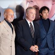 From left, Enzo Ghigo, actor Alec Baldwin and director Giulio Base pose for a photo, at the 42nd Turin Film Festival, in Turin, Italy (Matteo Secci/LaPresse via AP)