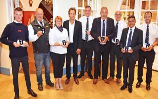 Members of the Lowestoft RNLI lifeboat are presented their medals by Lord Somerleyton.