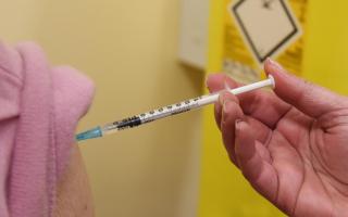 Eligible patients are being urged to book their Covid flu injections as soon as possible.